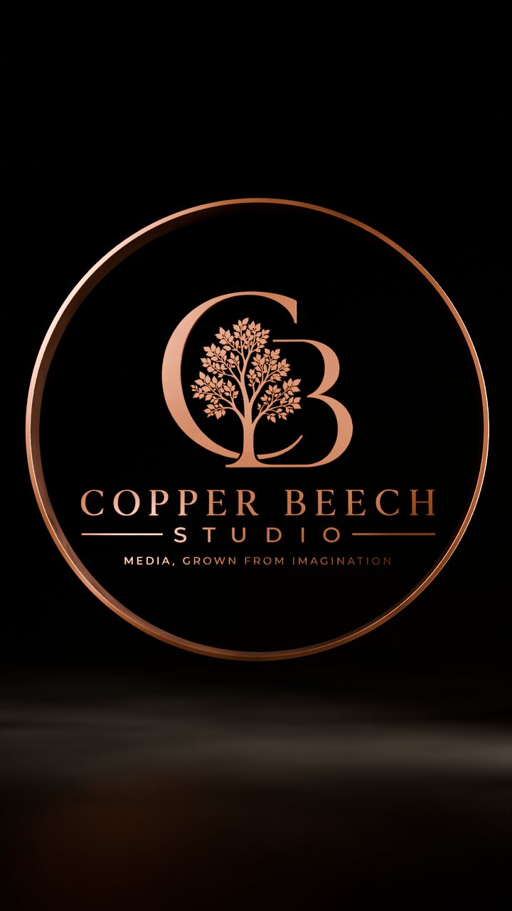 The Copper Beech Studio copper ring logo on a dark stage